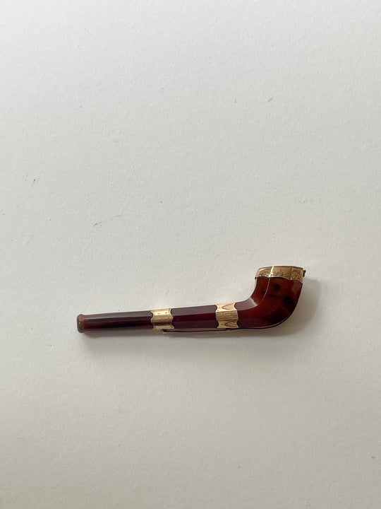 Gold mounted opium pipe.