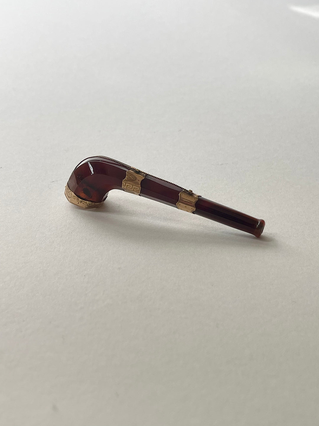 Gold mounted opium pipe.